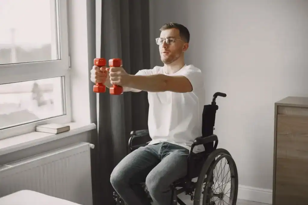 Image of man doing exercise in his wheelchair to aid weight loss Littlehampton